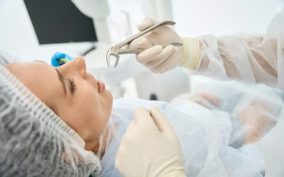 Young female patient in a dental chair on tooth extraction